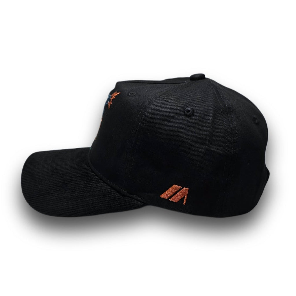 Side profile of black Swing Hard golf hat with corduroy visor